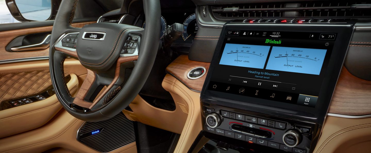 The interior of the 2021 Jeep Grand Cherokee L Summit Reserve with the touchscreen displaying power output settings in watts for the McIntosh speakers.