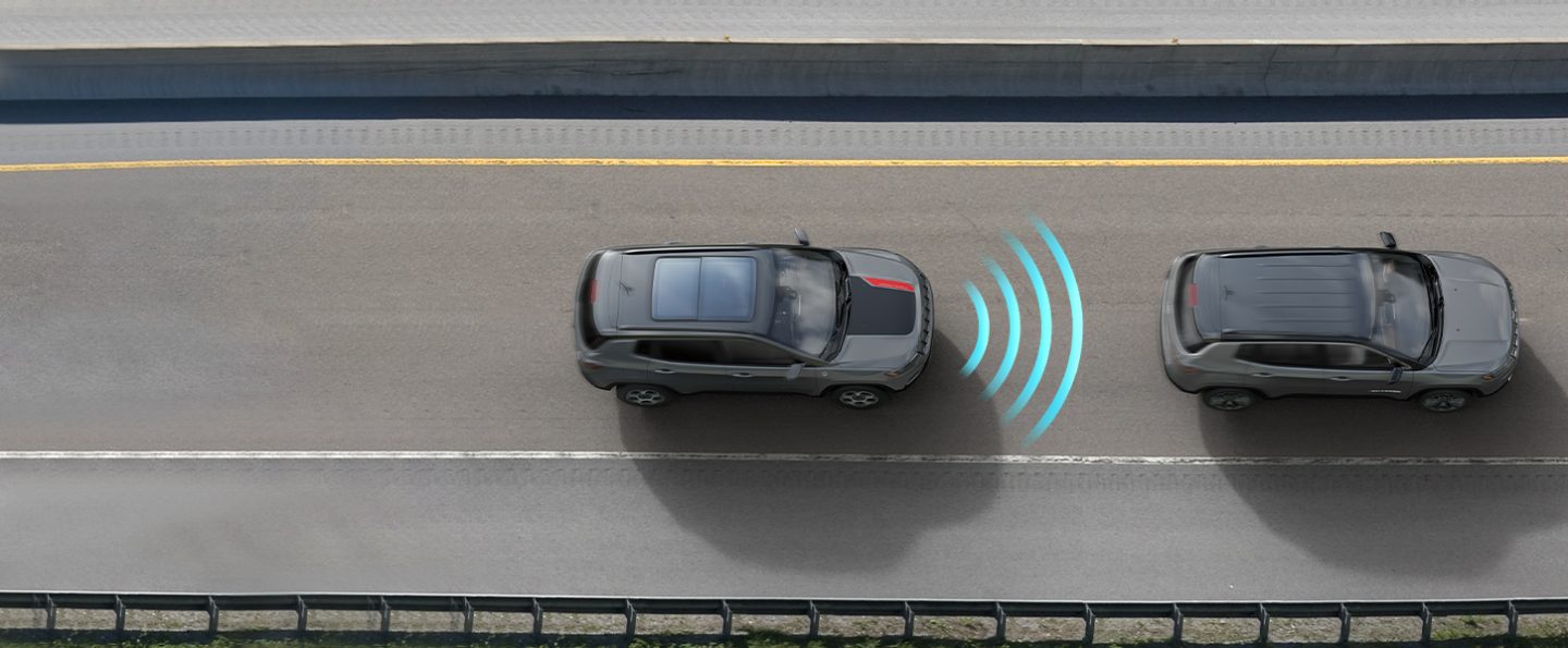 The 2022 Jeep Compass Trailhawk with illustrated sensor bars coming from its front as it approaches a vehicle ahead of it.