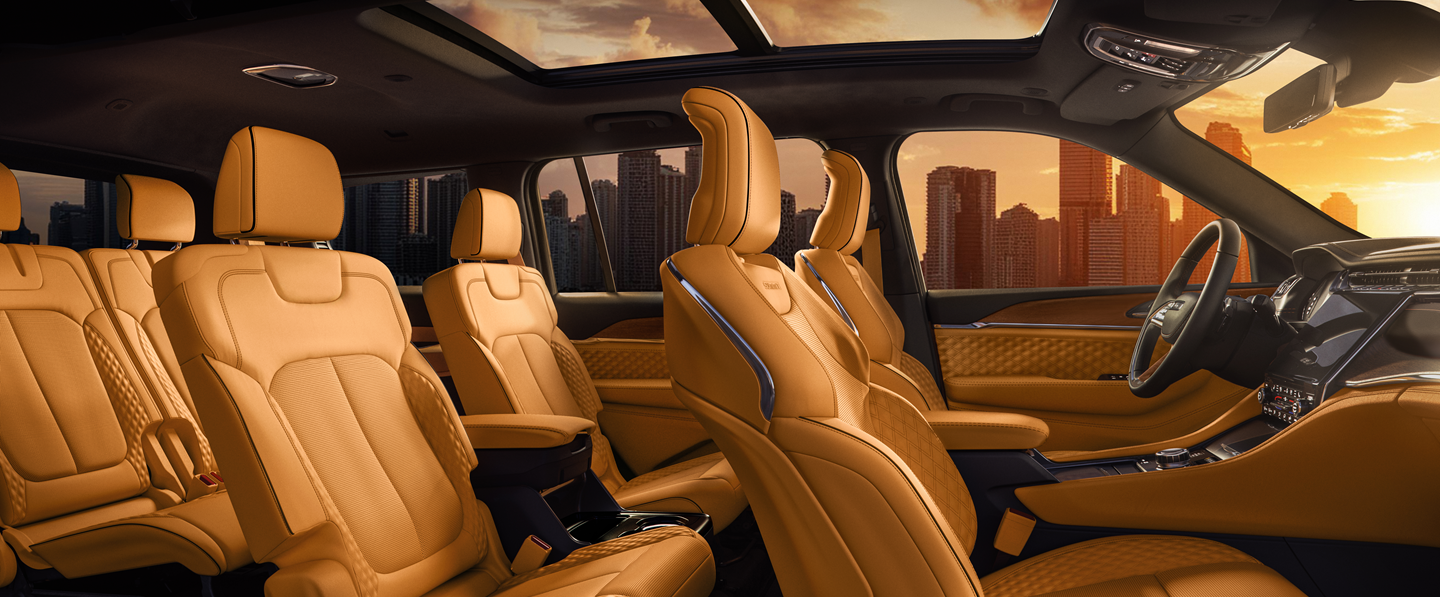 The cargo area of the 2024 Jeep Grand Cherokee loaded with luggage from top to bottom.