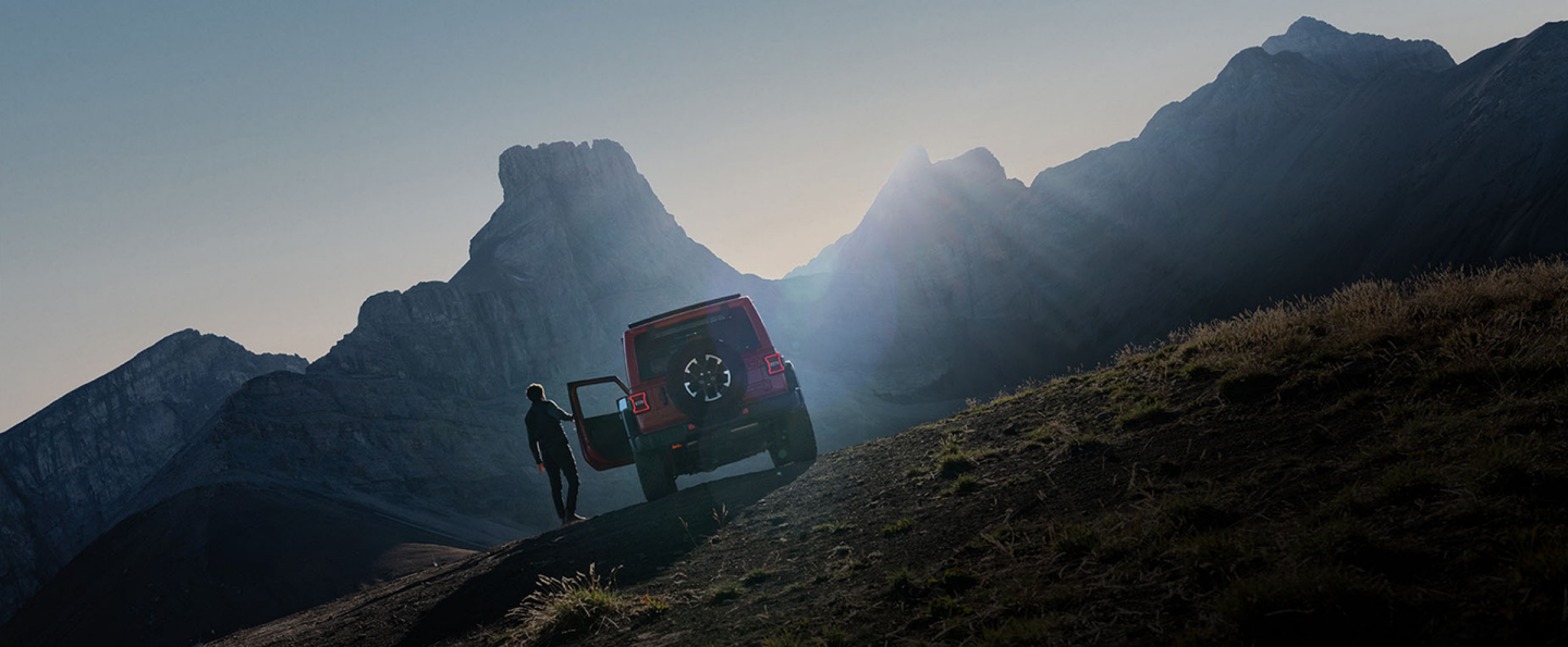 The Uconnect touchscreen in a 2026 Jeep Wrangler displaying a page in the Off-Road Trail Guide from Trails Offroad.